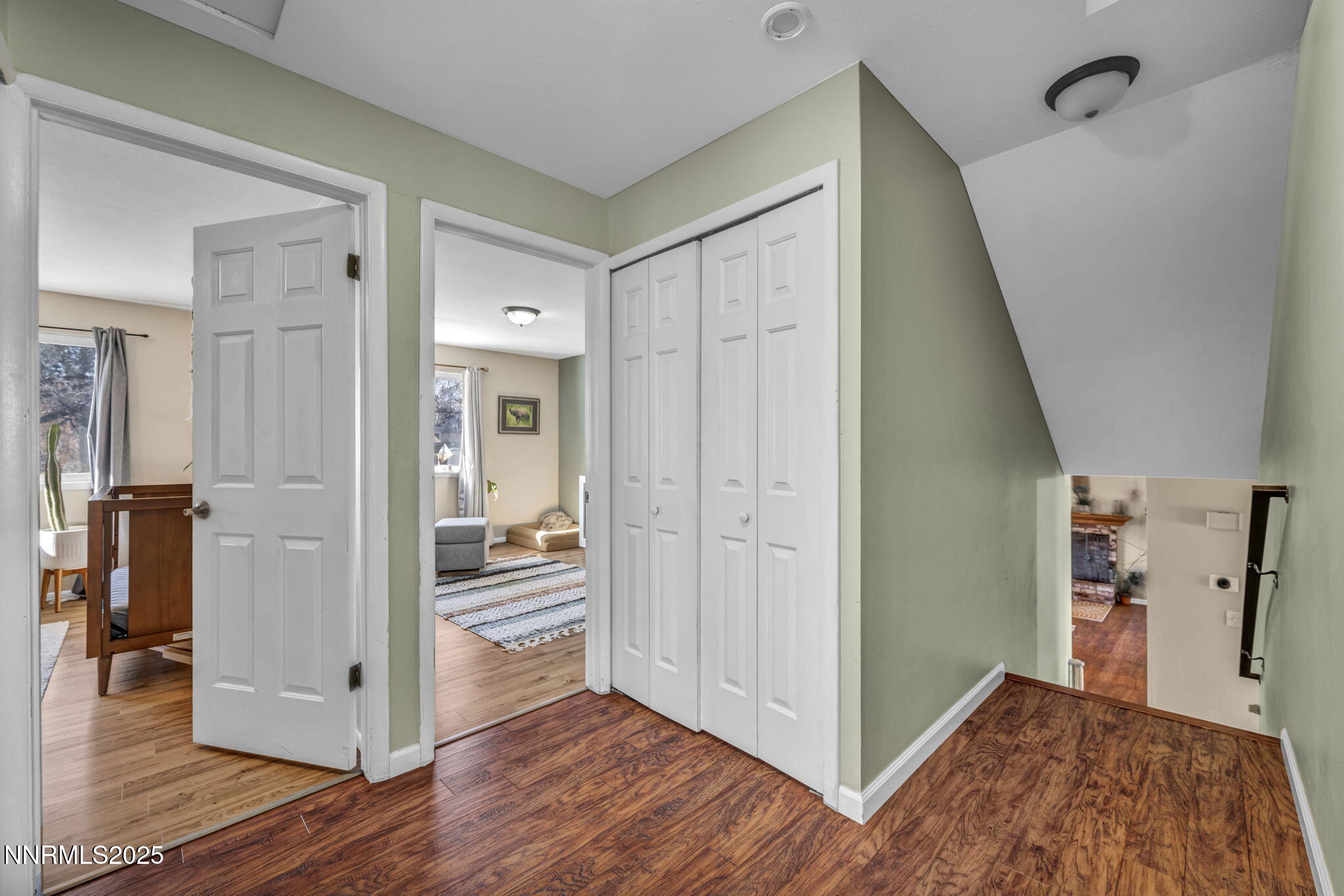 1100 Mission Circle Reno, NV 89503 - Photo 24 of 61 a view of a hallway with wooden floor and dining room view