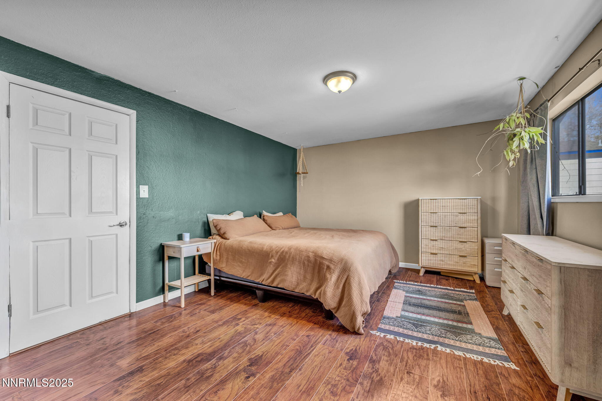 1100 Mission Circle Reno, NV 89503 - Photo 25 of 61 a spacious bedroom with a bed and a cabinets