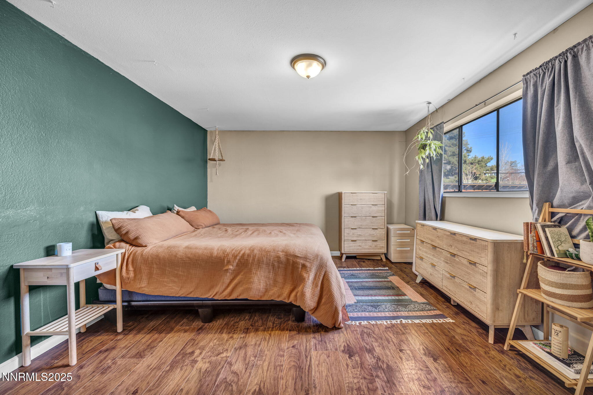 1100 Mission Circle Reno, NV 89503 - Photo 27 of 61 a bedroom with a bed and a large window