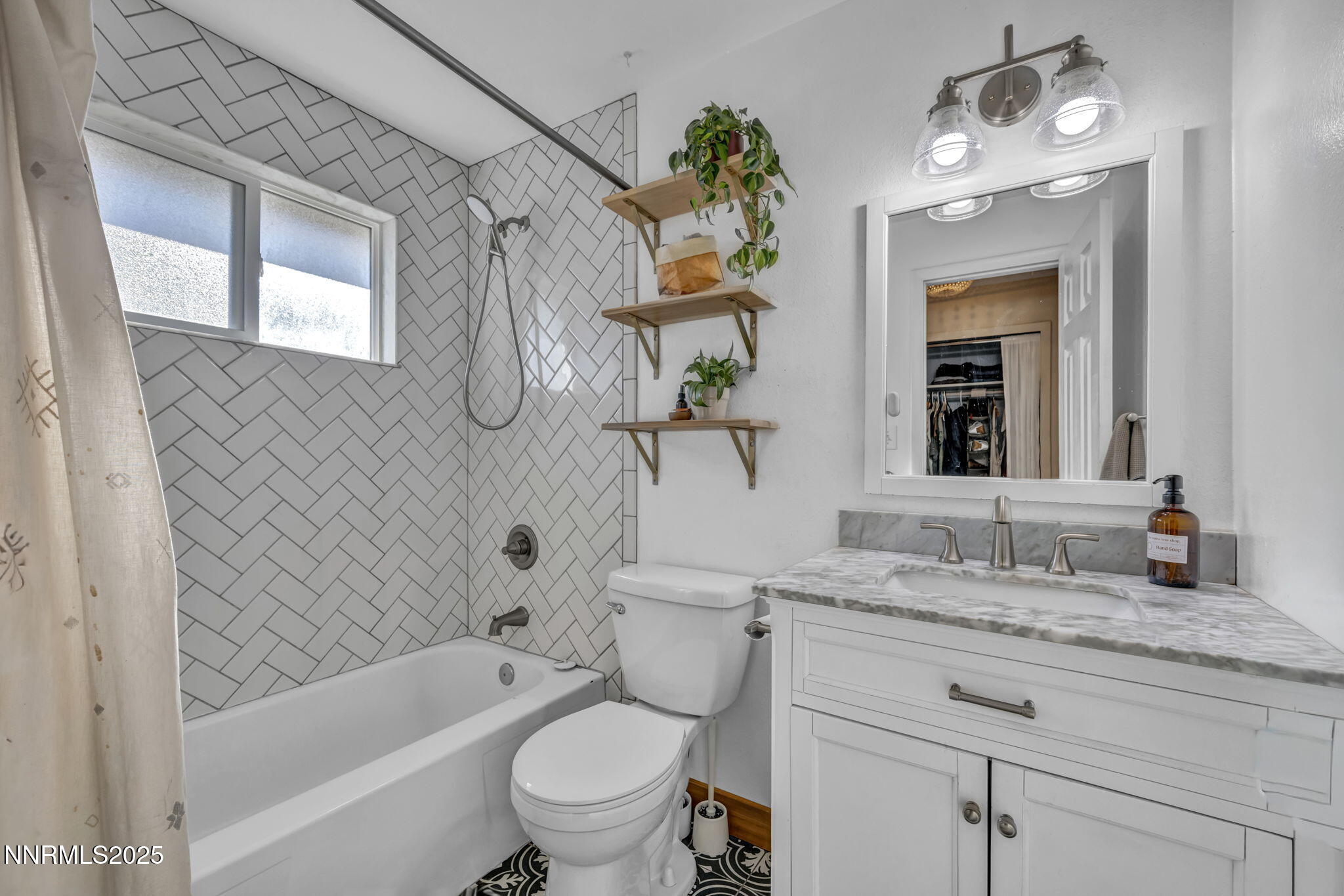 1100 Mission Circle Reno, NV 89503 - Photo 30 of 61 a bathroom with a granite countertop sink a toilet and bathtub
