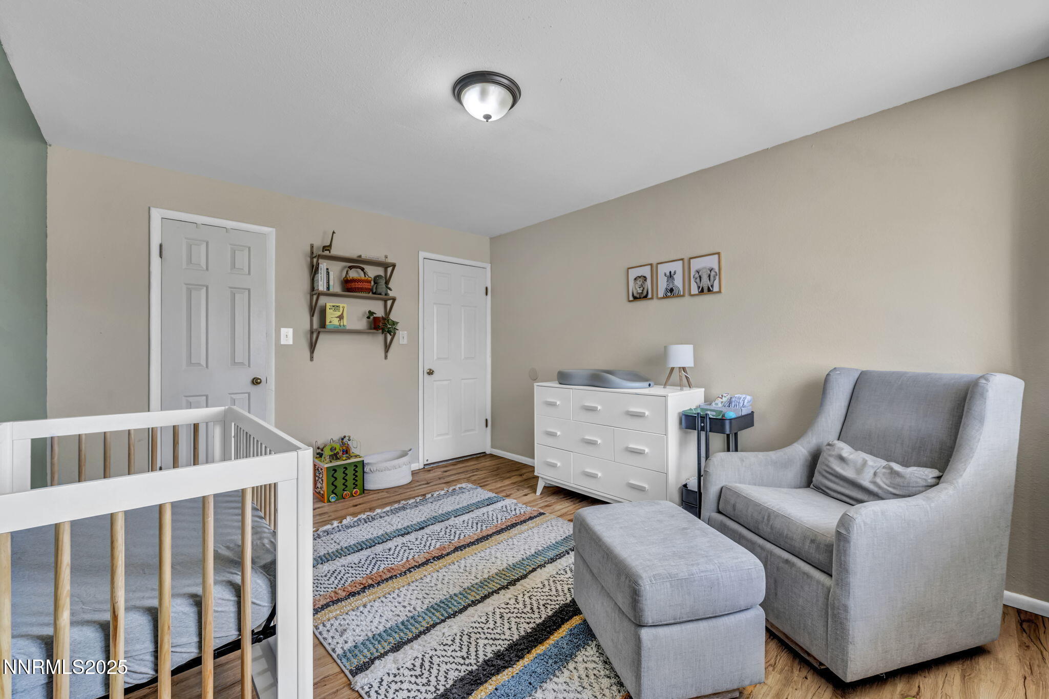 1100 Mission Circle Reno, NV 89503 - Photo 34 of 61 a bedroom with furniture and a wooden floor