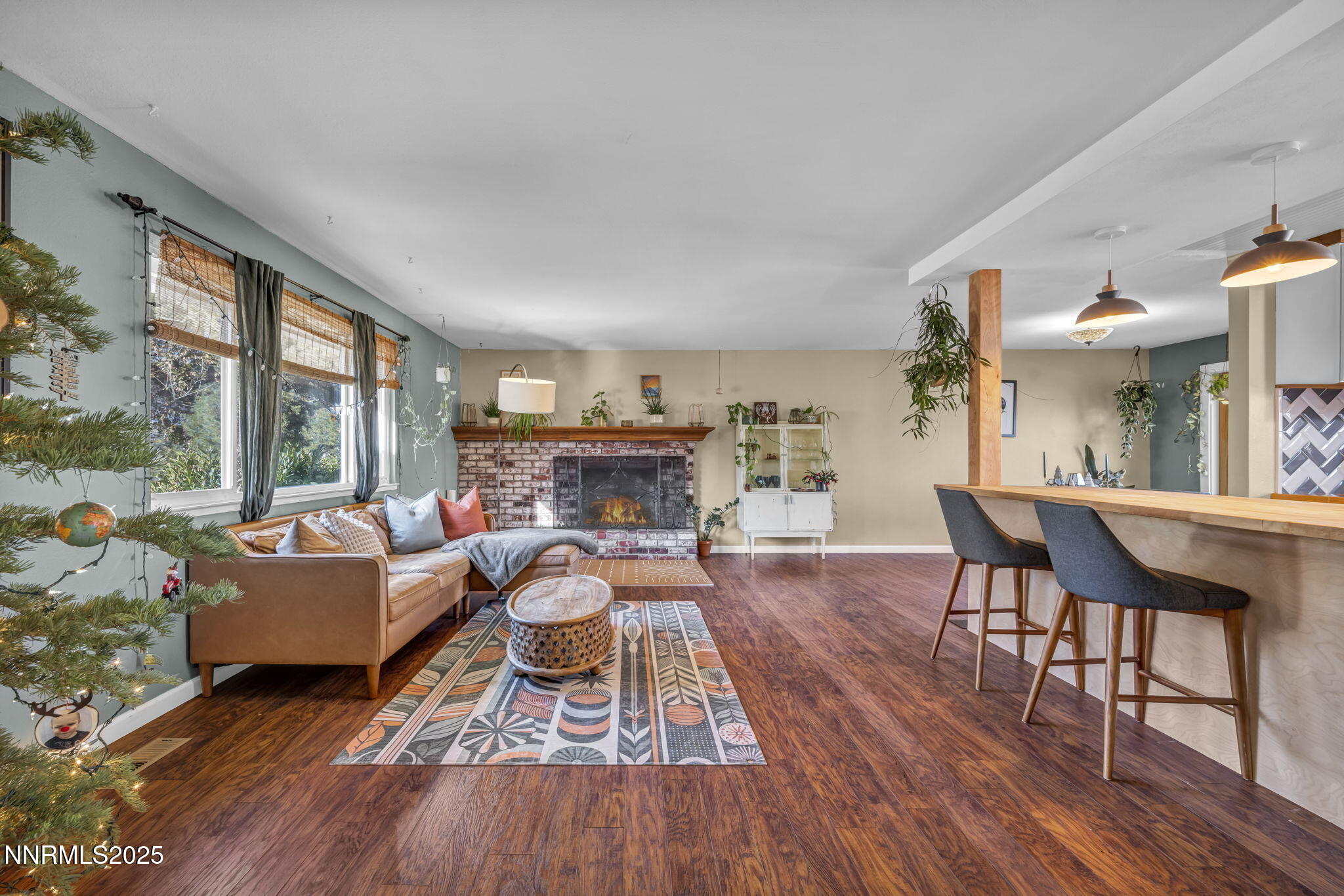 1100 Mission Circle Reno, NV 89503 - Photo 5 of 61 a living room with furniture a fireplace and a large window