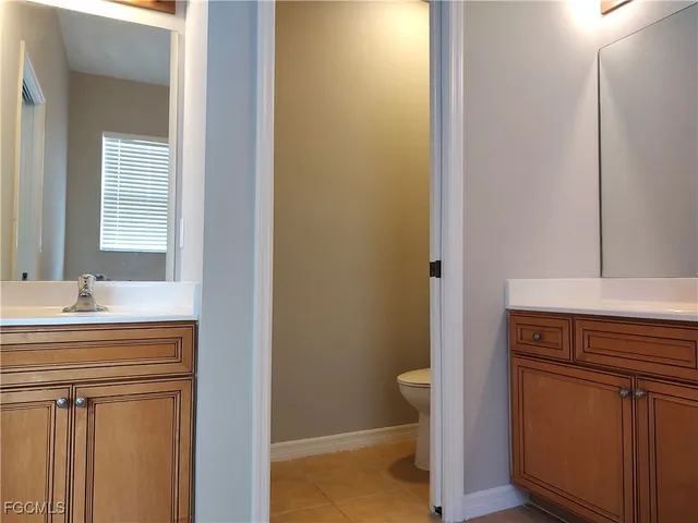 a bathroom with a sink a vanity and a mirror