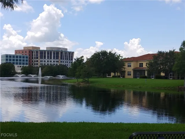 a view of a lake with a yard