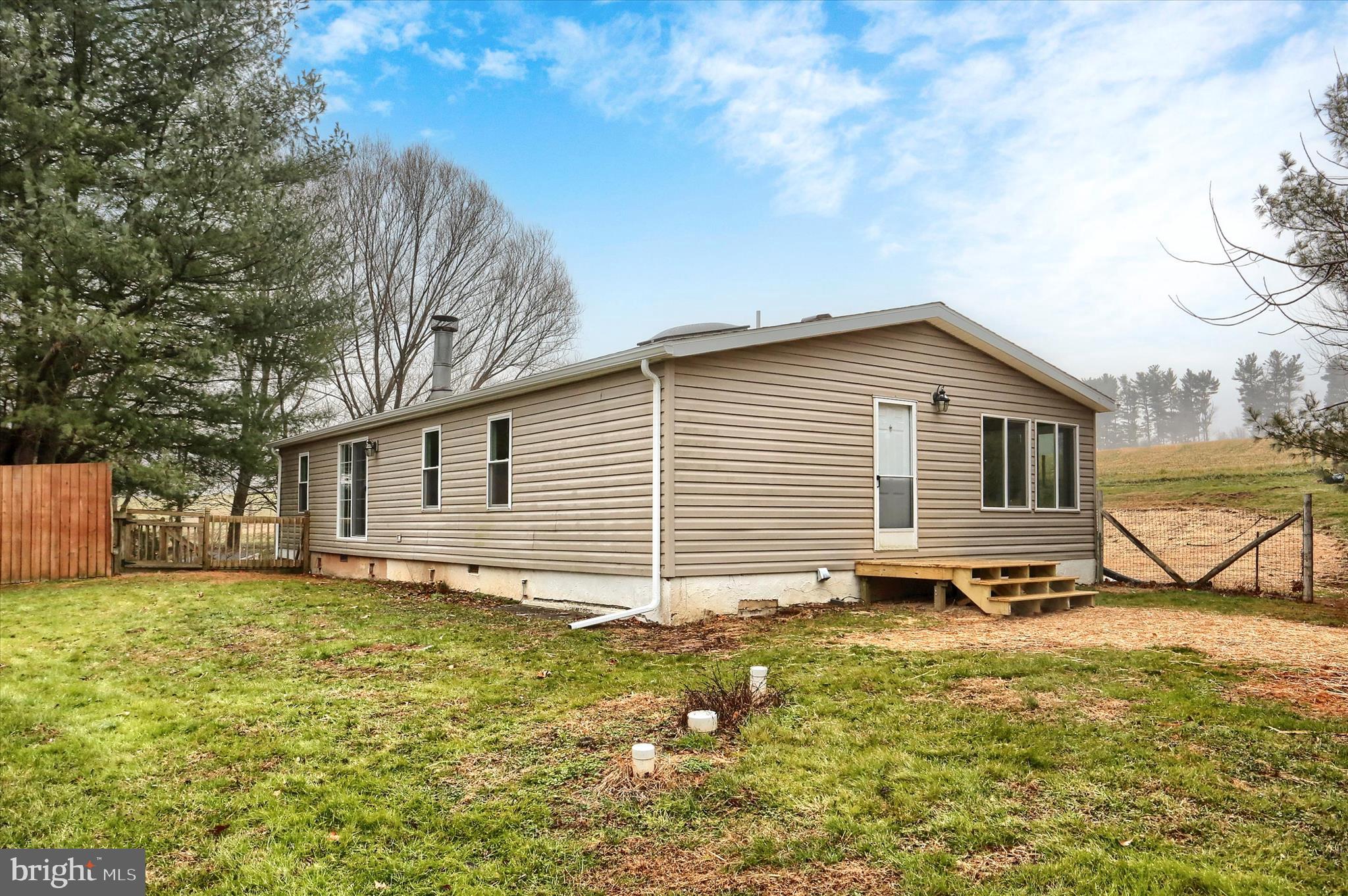 1311 Woodbine Road Airville, PA 17302 - Photo 26 of 29 a view of a house with a yard