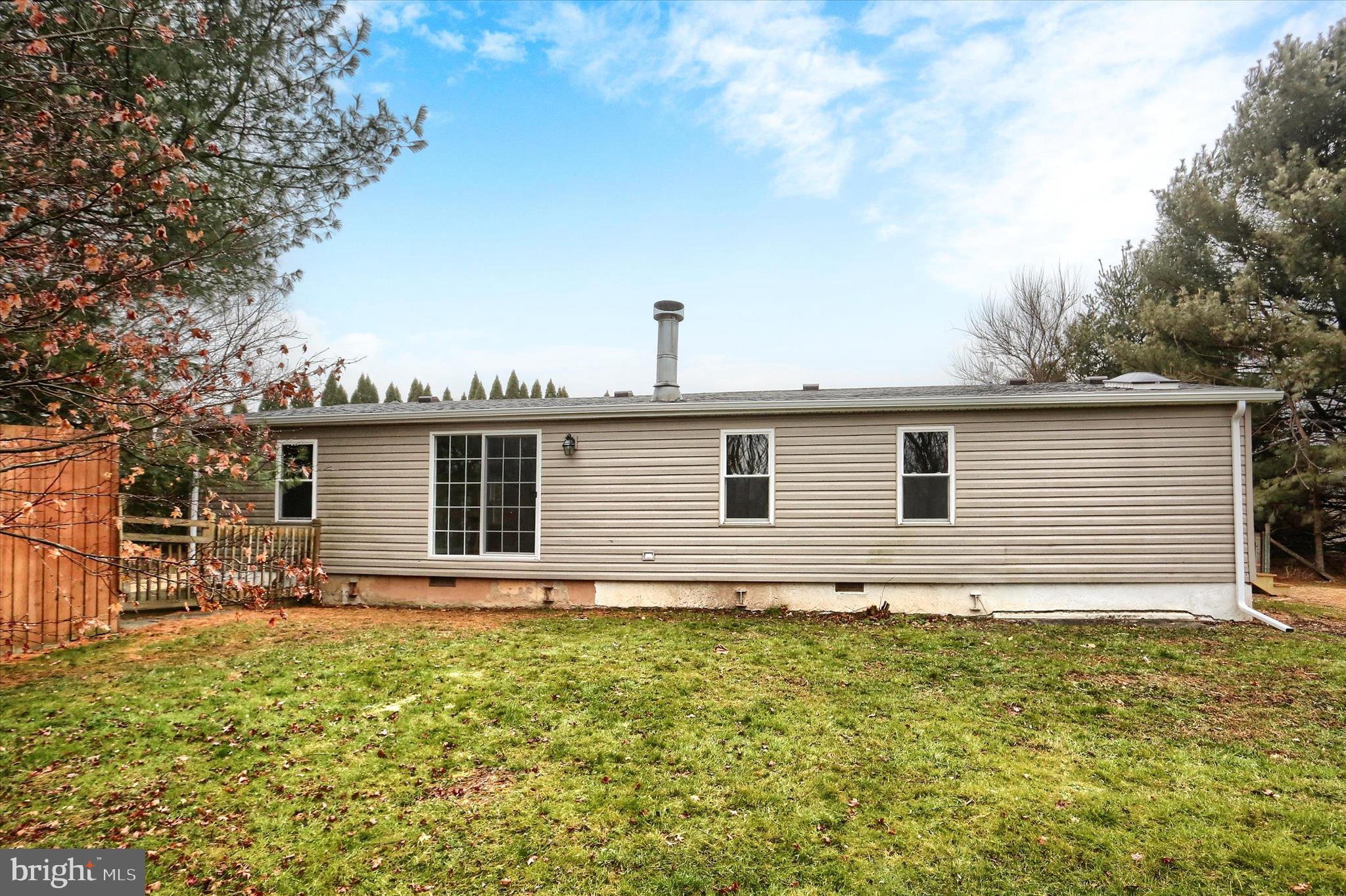 1311 Woodbine Road Airville, PA 17302 - Photo 27 of 29 a house that has a large tree in front of it