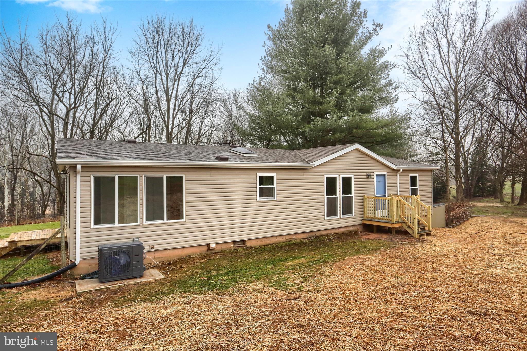 1311 Woodbine Road Airville, PA 17302 - Photo 3 of 29 a front view of a house with a yard