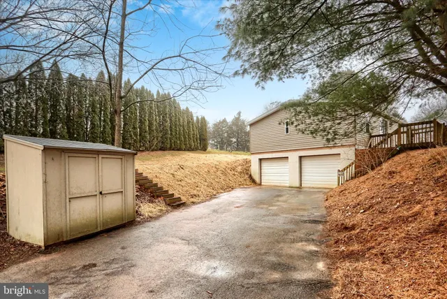 a view of a house with a snow in the yard