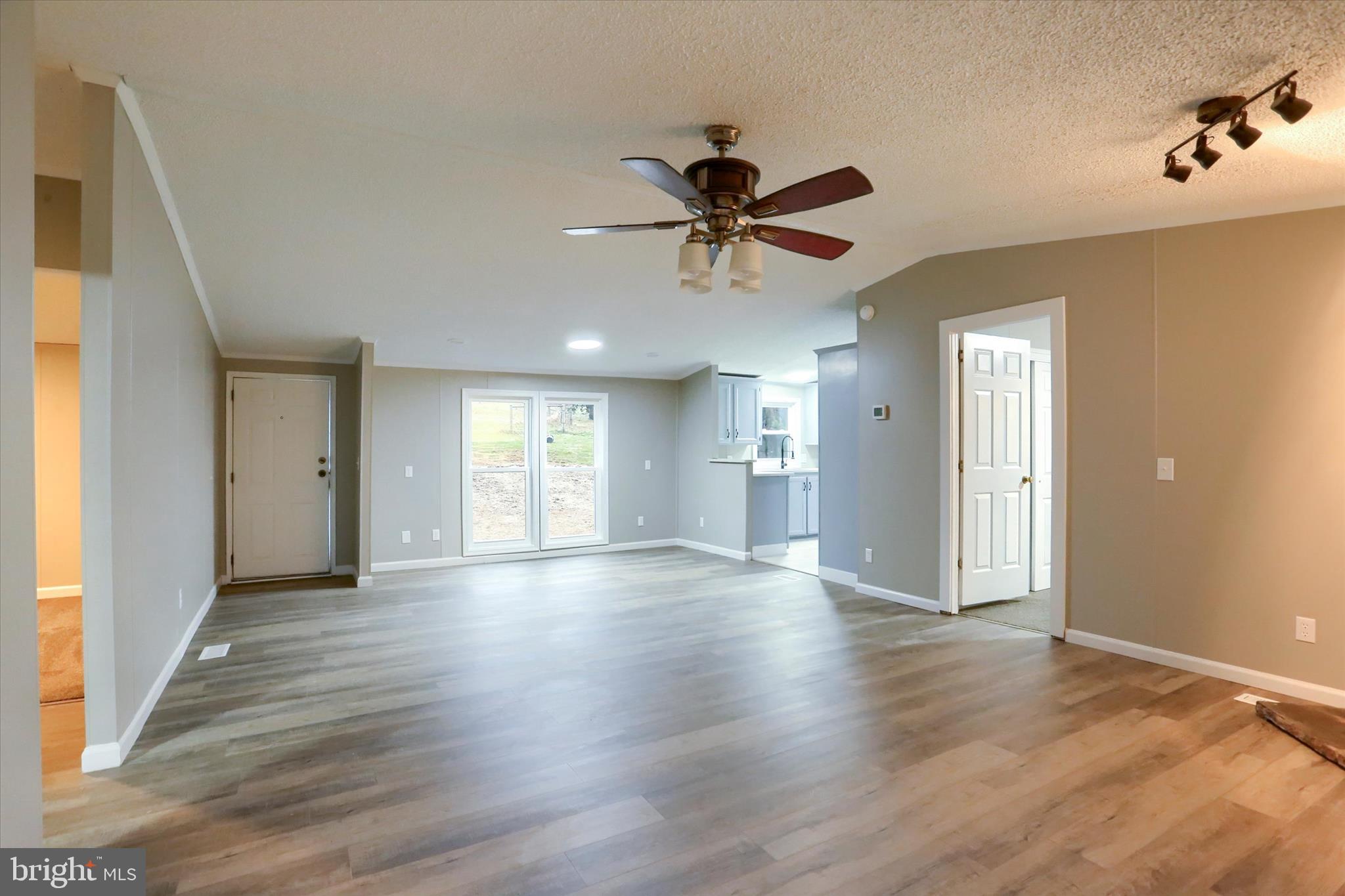 1311 Woodbine Road Airville, PA 17302 - Photo 7 of 29 a view of an empty room and window with wooden floor