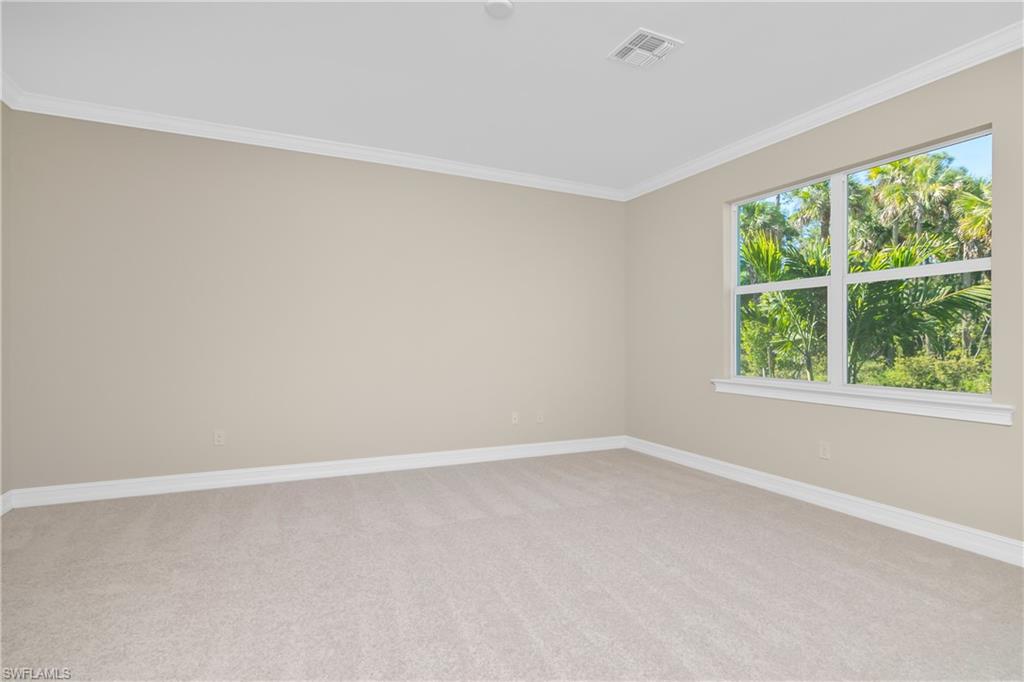 331 Tamarindo Lane Naples, FL 34114 - Photo 13 of 24 a view of an empty room with a window