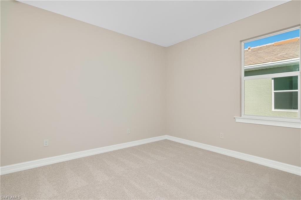331 Tamarindo Lane Naples, FL 34114 - Photo 17 of 24 an empty room with a window