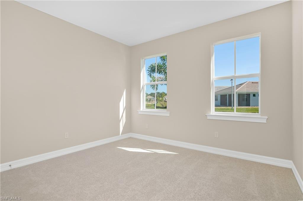 331 Tamarindo Lane Naples, FL 34114 - Photo 18 of 24 an empty room with windows