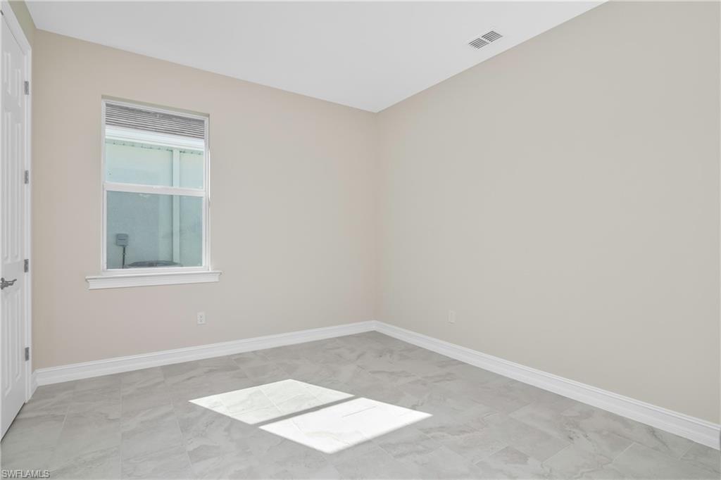 331 Tamarindo Lane Naples, FL 34114 - Photo 20 of 24 an empty room with a window