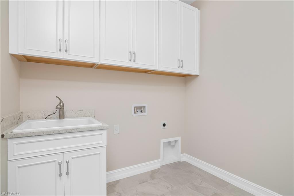 331 Tamarindo Lane Naples, FL 34114 - Photo 21 of 24 a bathroom with a sink