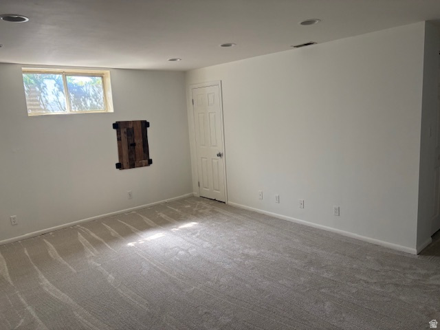 2313 150 East Bountiful, UT 84010 - Photo 31 of 39 Spacious room featuring neutral carpeting, recessed lighting, and a white paneled door