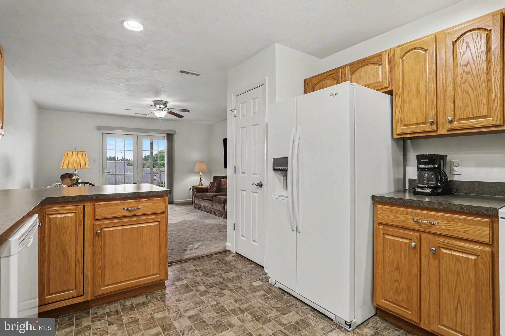1371 Chami Drive, Unit 166 Spring Grove, PA 17362 - Photo 11 of 28 a kitchen with stainless steel appliances granite countertop a refrigerator a sink dishwasher and cabinets with wooden floor