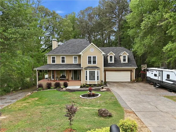 a front view of a house with garden