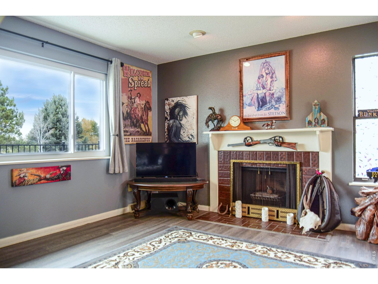 4404 West 4th Street Road Greeley, CO 80634 - Photo 3 of 28 Living room with cozy fireplace