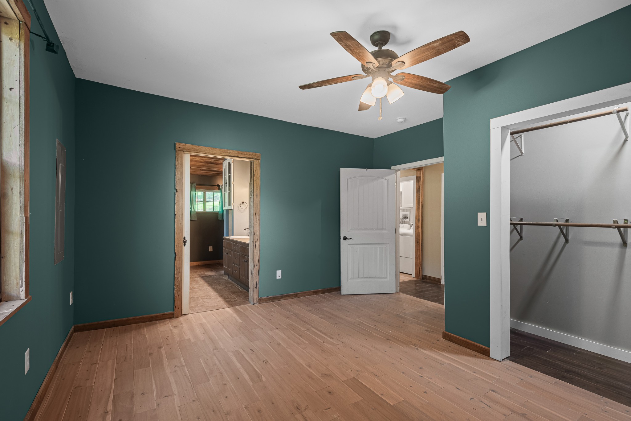 3671 Raleigh Beard Road Santa Fe, TN 38482 - Photo 15 of 32 a view of a livingroom with a ceiling fan and wooden floor