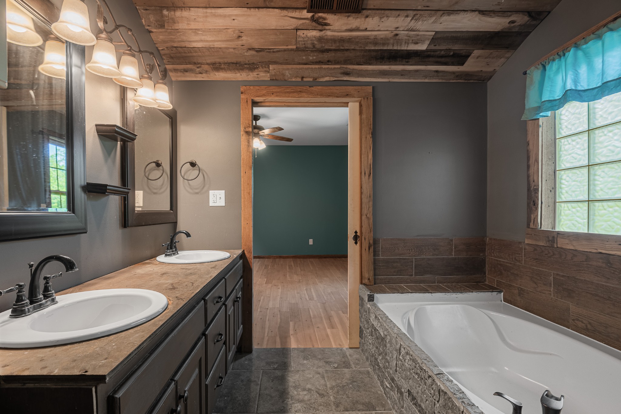 3671 Raleigh Beard Road Santa Fe, TN 38482 - Photo 18 of 32 a spacious bathroom with a granite countertop tub sink and mirror