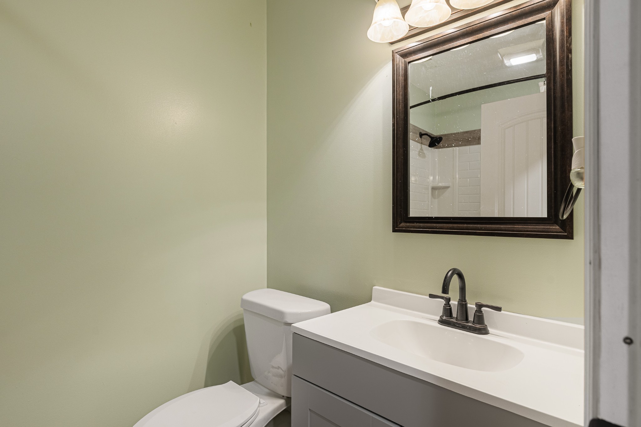 3671 Raleigh Beard Road Santa Fe, TN 38482 - Photo 22 of 32 a bathroom with a toilet sink vanity and mirror