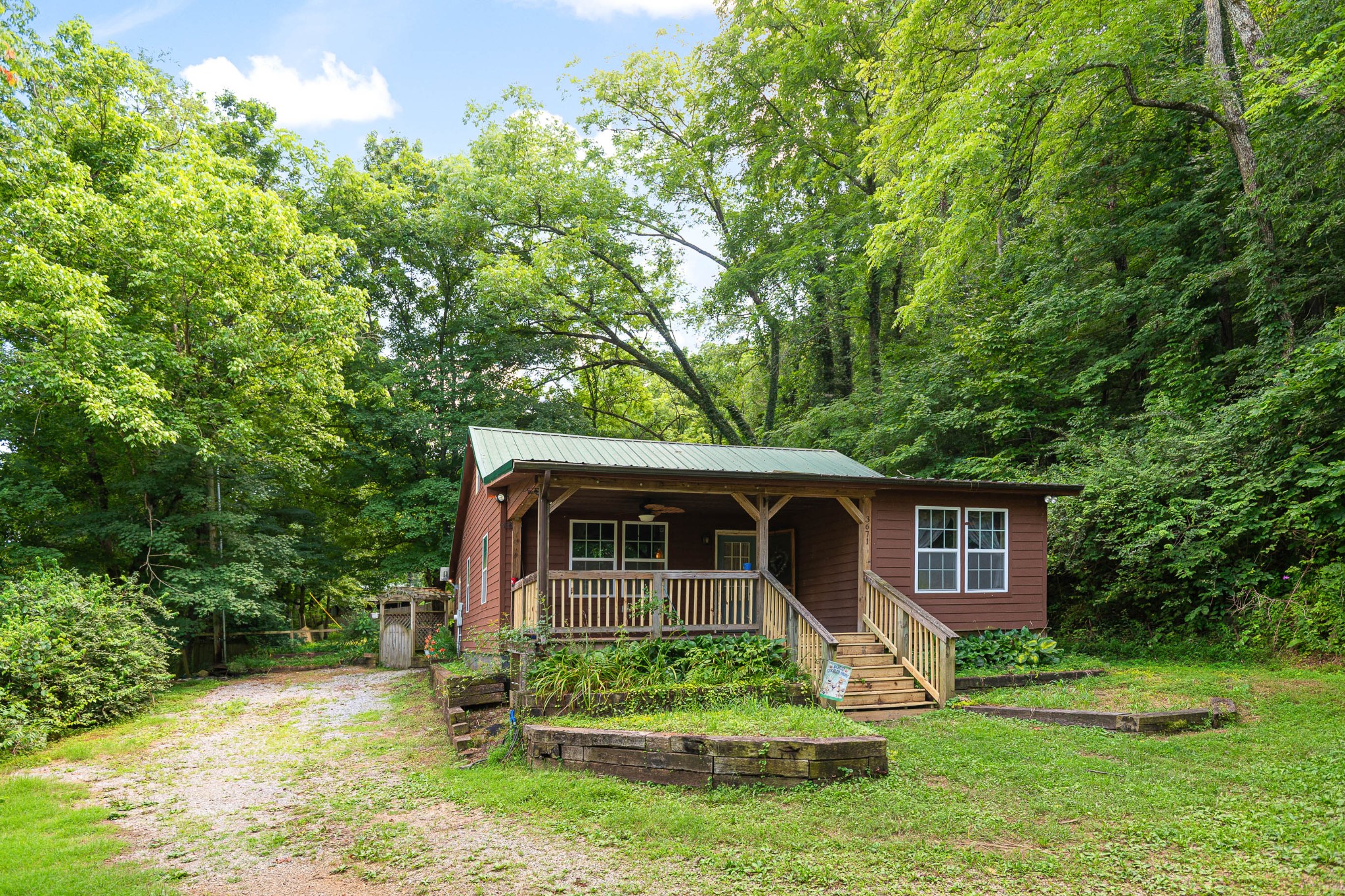 3671 Raleigh Beard Road Santa Fe, TN 38482 - Photo 3 of 32 a front view of a house with a yard