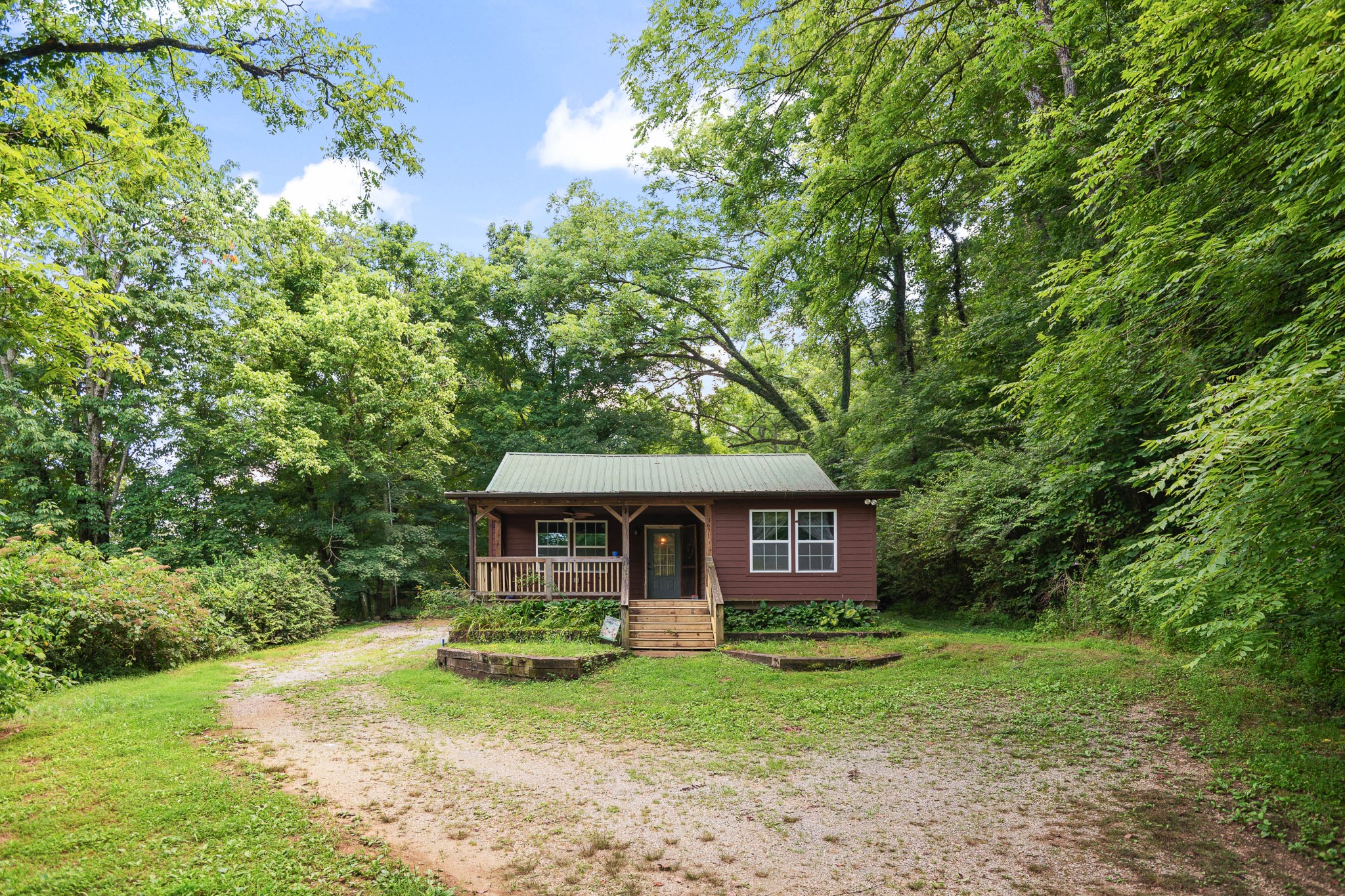 3671 Raleigh Beard Road Santa Fe, TN 38482 - Photo 4 of 32 a front view of a house with yard and green space