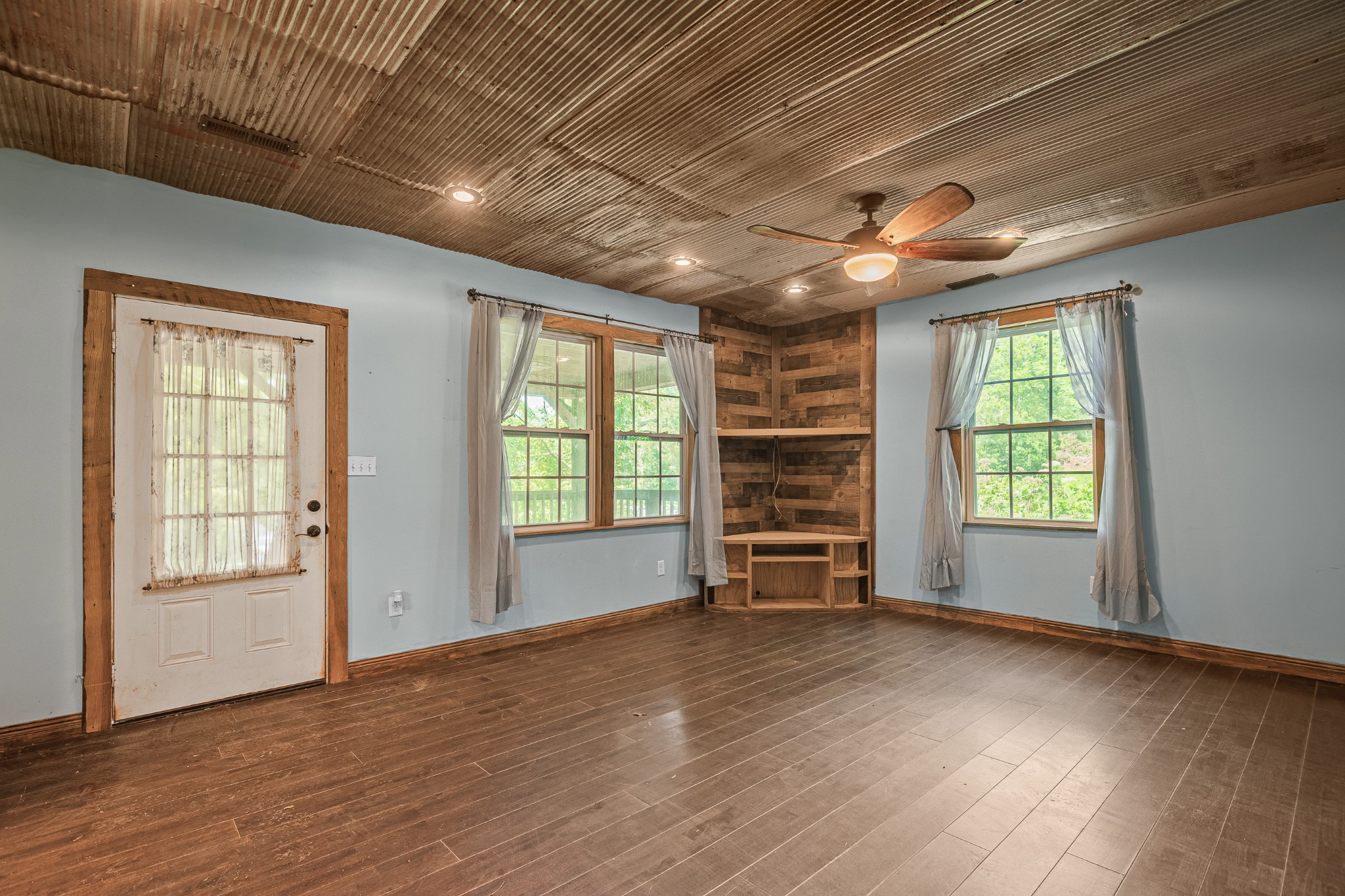 3671 Raleigh Beard Road Santa Fe, TN 38482 - Photo 8 of 32 an empty room with wooden floor and windows