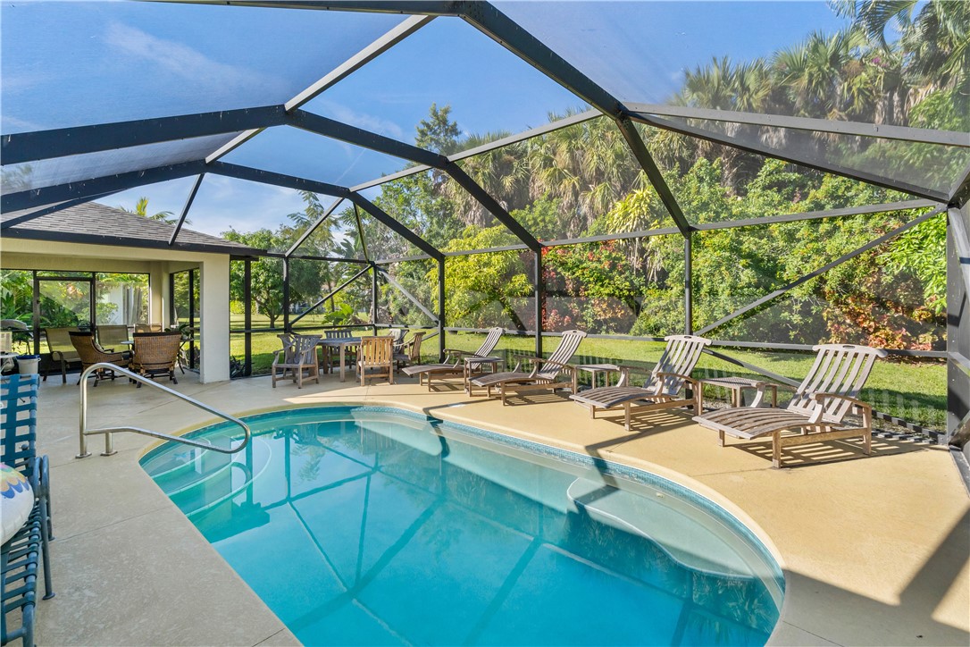 3660 2nd Street Southwest Vero Beach, FL 32968 - Photo 1 of 36 a view of a swimming pool with outdoor seating
