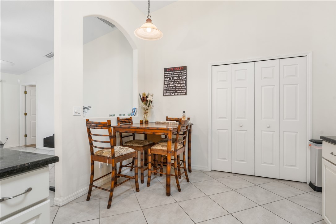 3660 2nd Street Southwest Vero Beach, FL 32968 - Photo 15 of 36 a dining room with furniture and wooden floor
