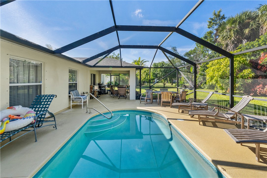 3660 2nd Street Southwest Vero Beach, FL 32968 - Photo 22 of 36 a view of a swimming pool with outdoor seating