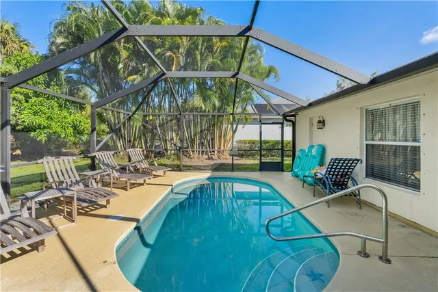 a view of a swimming pool with a patio