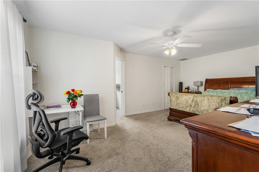 3660 2nd Street Southwest Vero Beach, FL 32968 - Photo 25 of 36 a living room with furniture and a chandelier