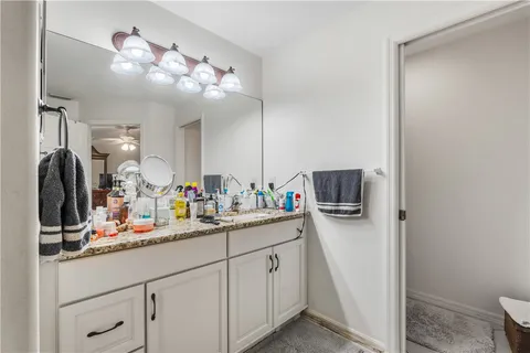 a bathroom with a sink a vanity and mirror
