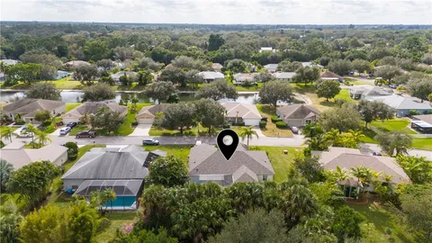 an aerial view of a house with a garden