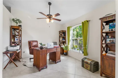 a workspace with furniture and a window