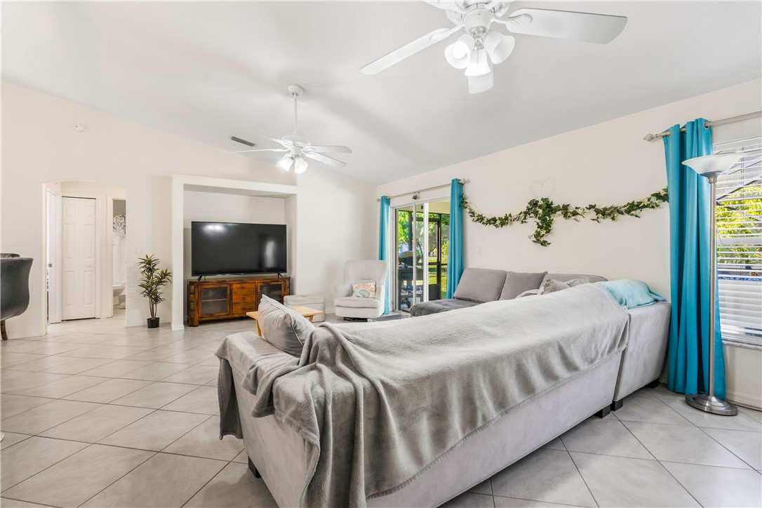 3660 2nd Street Southwest Vero Beach, FL 32968 - Photo 6 of 36 a bedroom with a bed and a flat screen tv