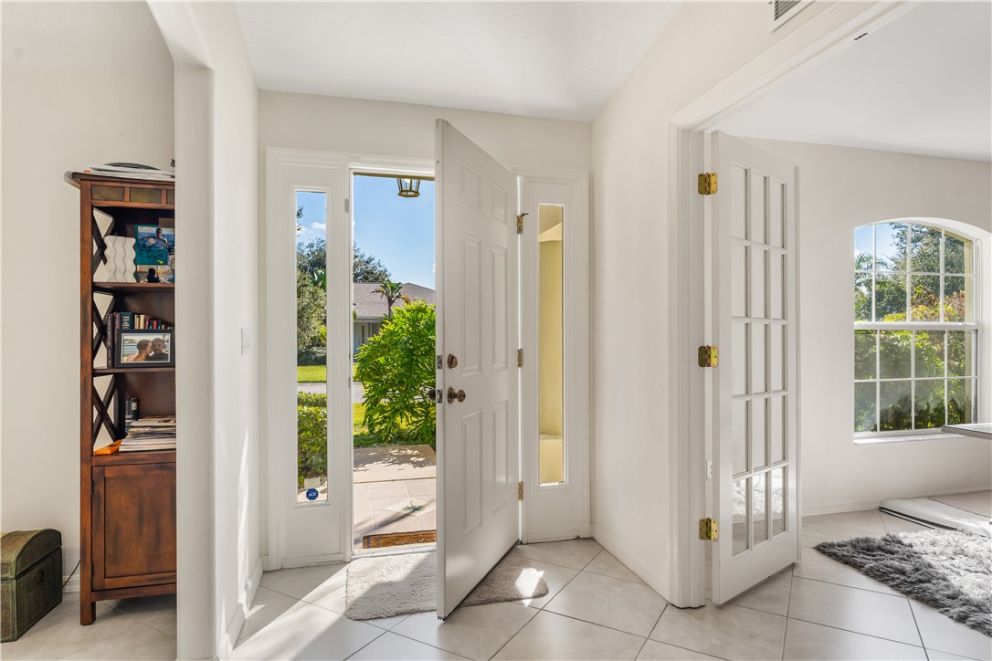 3660 2nd Street Southwest Vero Beach, FL 32968 - Photo 7 of 36 a view of entryway with wooden floor and cabinet