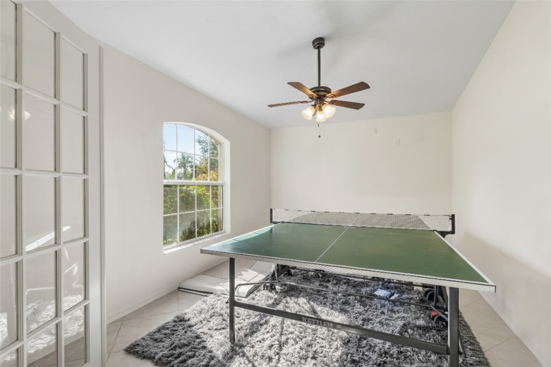 3660 2nd Street Southwest Vero Beach, FL 32968 - Photo 8 of 36 a living room with a window and a rug