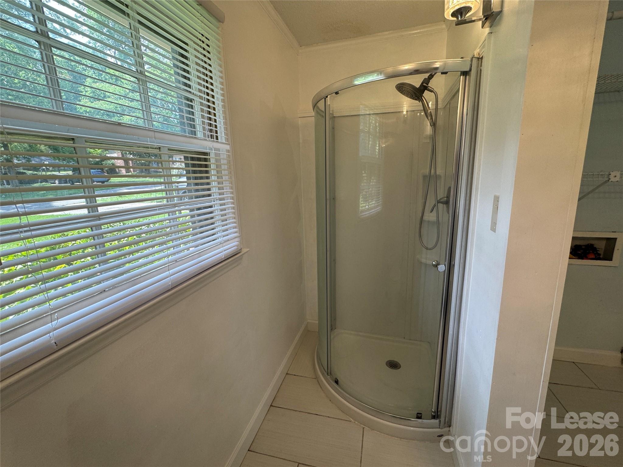 315 Pine Road Mount Holly, NC 28120 - Photo 16 of 21 a bathroom with a glass shower door