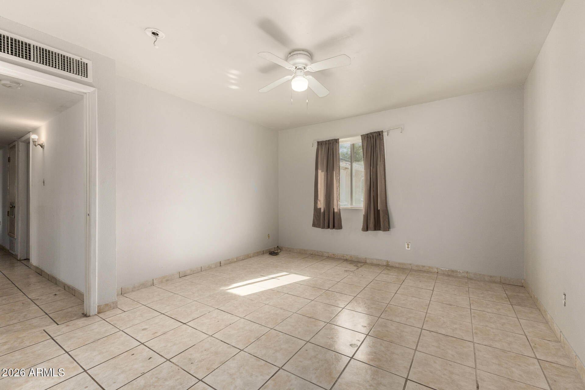 463 South Daley Mesa, AZ 85204 - Photo 11 of 28 an empty room with windows and fan