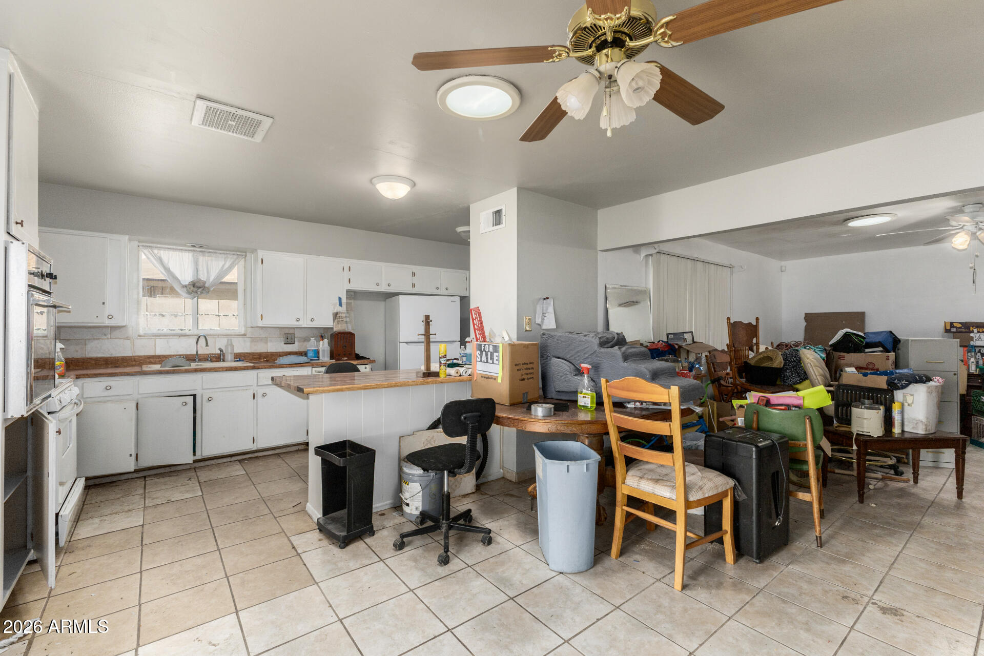 463 South Daley Mesa, AZ 85204 - Photo 6 of 28 a large white kitchen with a table and chairs