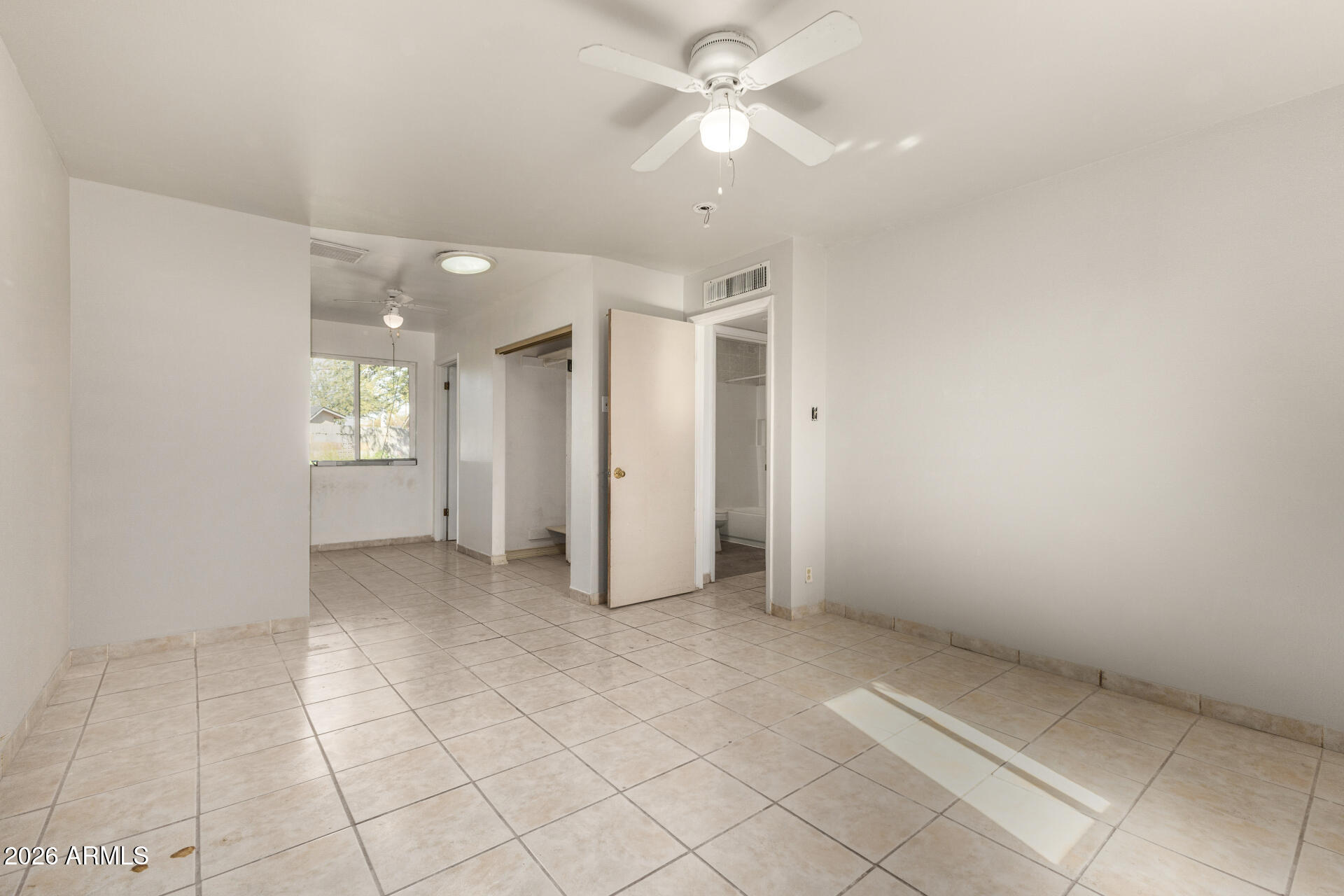 463 South Daley Mesa, AZ 85204 - Photo 10 of 28 an empty room with a ceiling fan and carpet