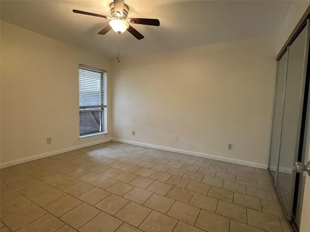 a bathroom with a toilet sink vanity and mirror
