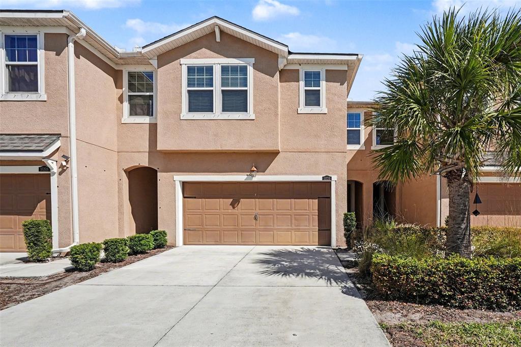 10210 Newel Valley Loop Riverview, FL 33569 - Photo 1 of 30 a front view of a house with a yard and garage