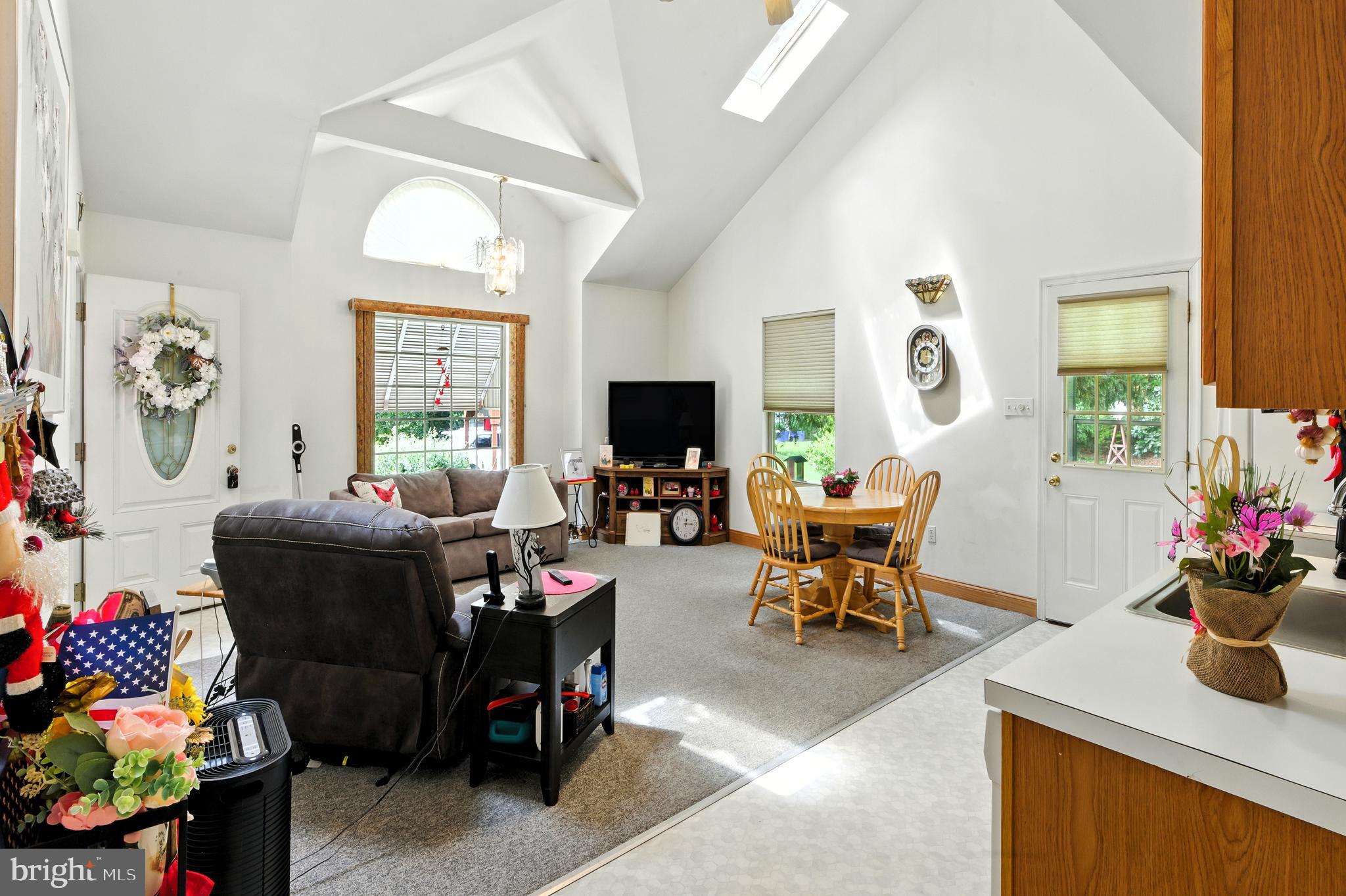 112 Hammonton Buena, NJ 08310 - Photo 11 of 34 a living room with furniture a flat screen tv and a window