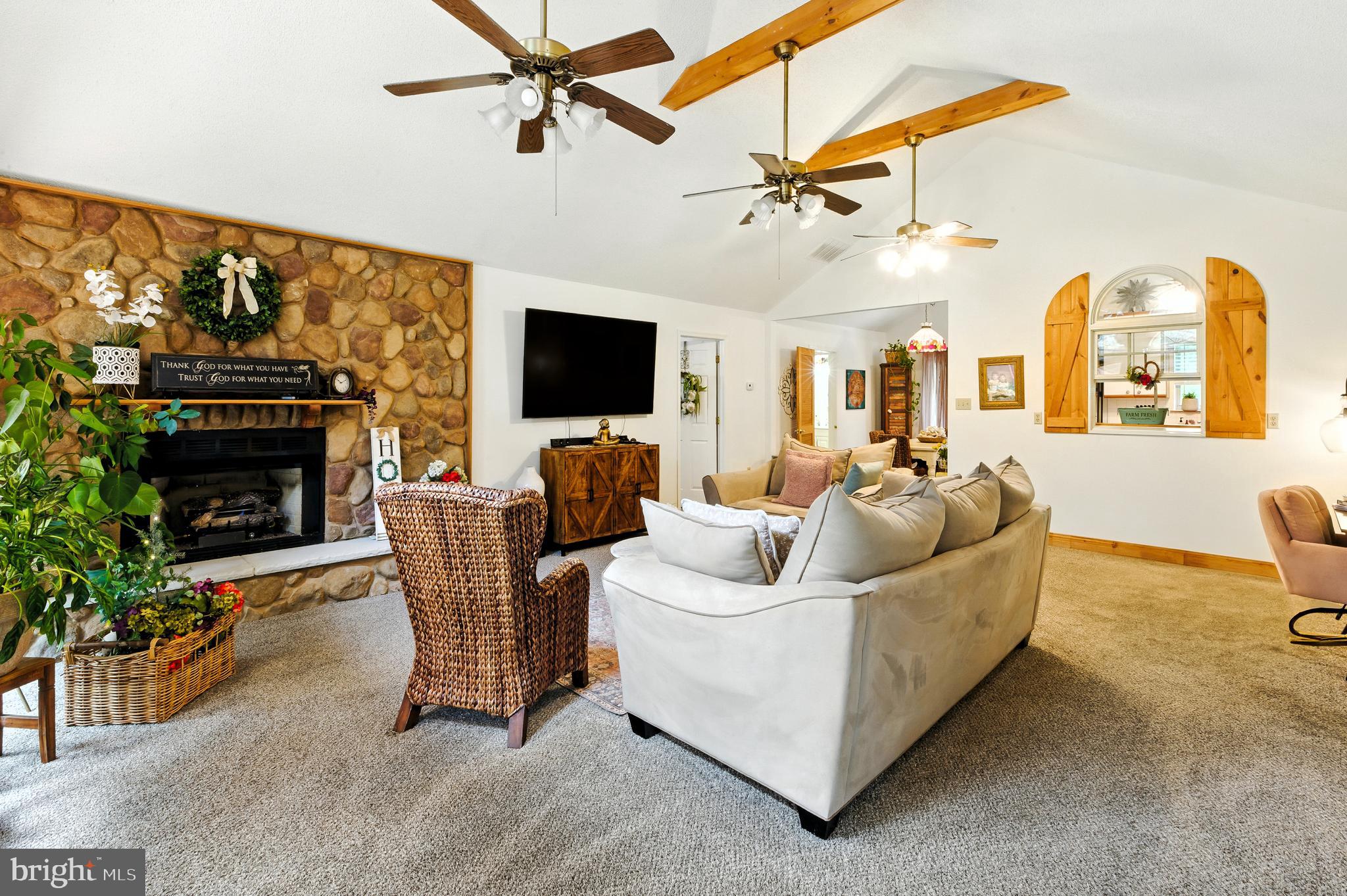 112 Hammonton Buena, NJ 08310 - Photo 16 of 34 a living room with furniture a flat screen tv and a fireplace