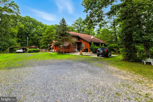 a view of outdoor space with garden and trees