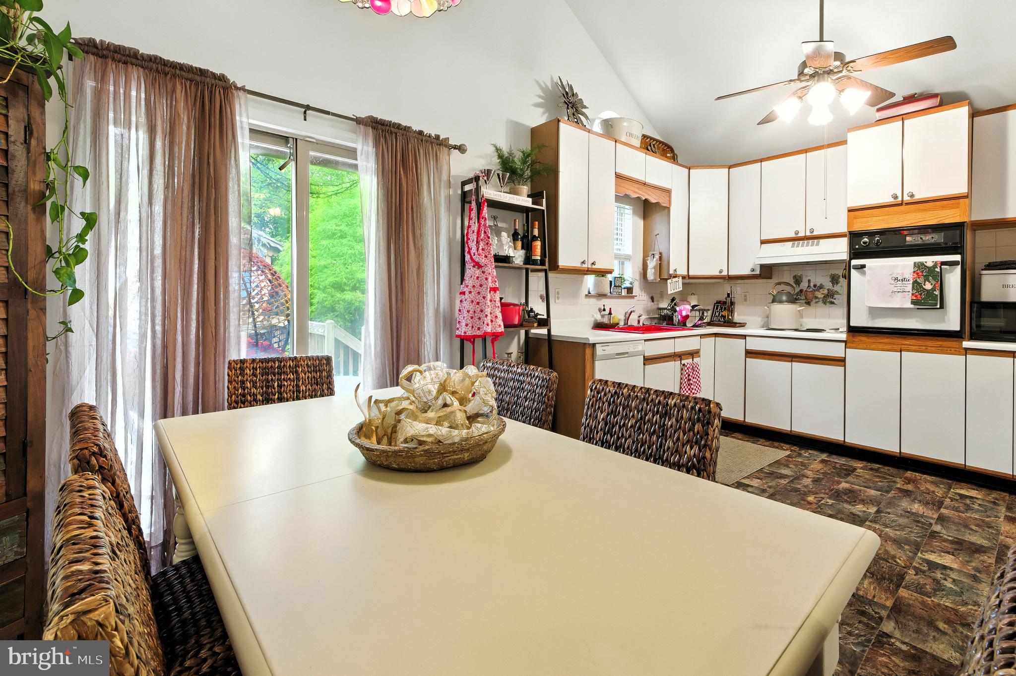 112 Hammonton Buena, NJ 08310 - Photo 22 of 34 a kitchen with a stove a refrigerator and a dining table