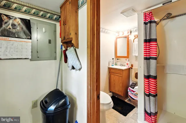 with a bathroom with a toilet and a shower